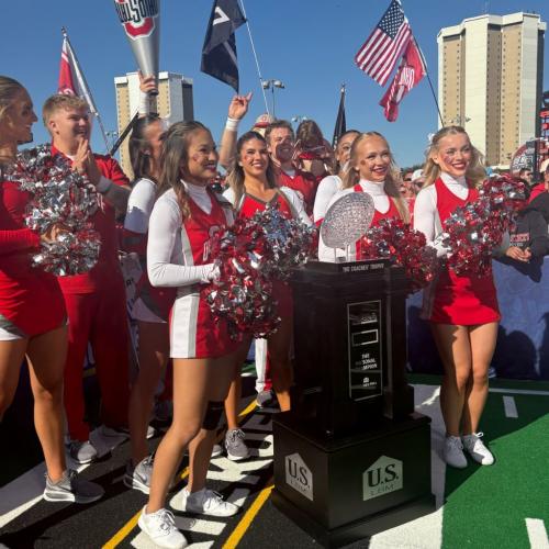 Ohio State Cheerleaders with Coaches Trophy